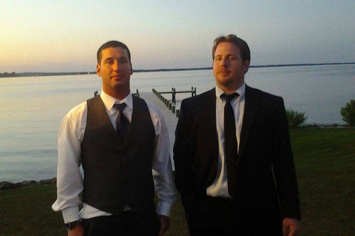 Josh Goldberg, left, and Patrick Colton, right, standing at the water in Annapolis, Maryland, in 2014